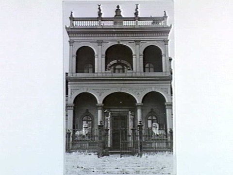 Chinese Joss House in Quiet [sic] [i.e. Raglan] street, South Melbourne, Vic. The gates are heavily barred & padlocked & secured, c. 1940