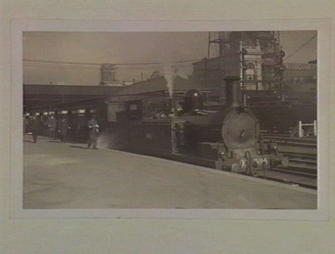 [Train at Flinders Street Railway Station] [Steam locomotive engine number E 394], 1909