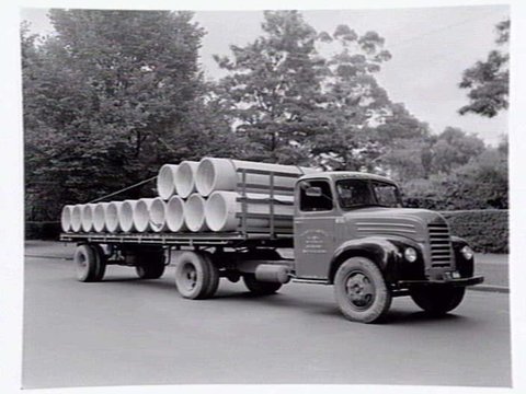 Truck from Humes Limited, 114 King Street, Melbourne, loaded with pipes, 1950?