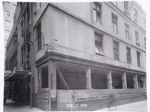 Construction for the Degraves Street Subway showing the Ackman's building at 250 Flinders St., Melbourne, being excavated for the Degraves St. entrance steps, 1953