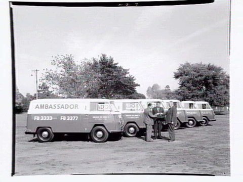 Fleet of vans from the Ambassador Hire Service, 27 Little Bourke St, 1938