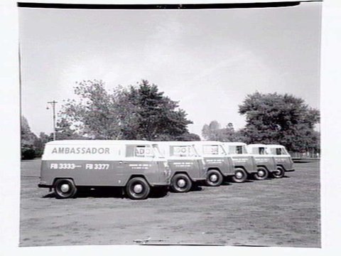 Fleet of vans from the Ambassador Hire Service, 27 Little Bourke St, 1938