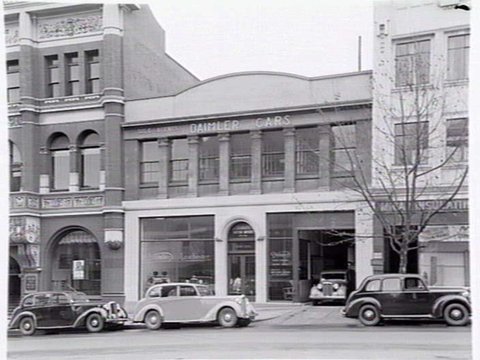 Joubert's British Motors, 566-8 Bourke St., Melbourne, showing exterior and cars in showroom, 1948