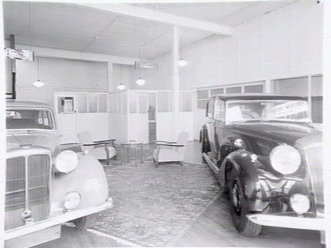 Joubert's British Motors, 566-8 Bourke St., Melbourne, showing exterior and cars in showroom, 1948