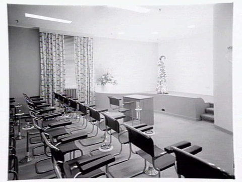 Julius Kayser & Co., 2nd floor, 328-42 Flinders Lane, Melbourne, showing small theatrette for mannequin displays, outer showroom area with display of Kayser sleeping gowns and office area, 1949