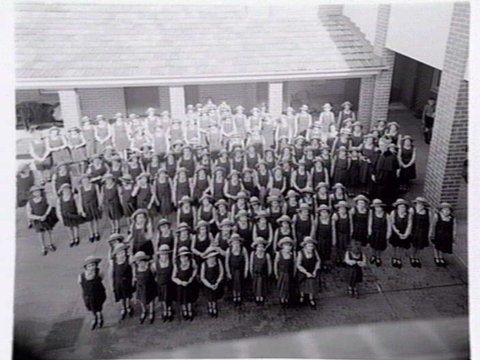 St. Vincent de Paul Girls' Orphanage, Napier St., South Melbourne, showing exterior views, girls in quadrangle and interiors of chapel, dining room and kitchen, c. 1940