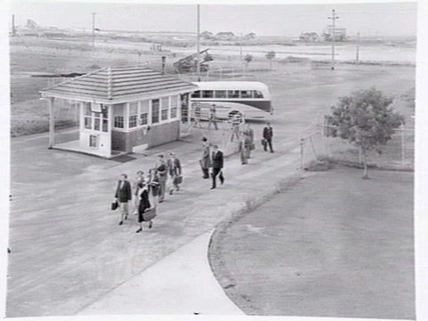 Monsanto Chemicals, Sommerville Rd., Braybrook, showing workers arriving by bus at front gate, plant and head office, 1950