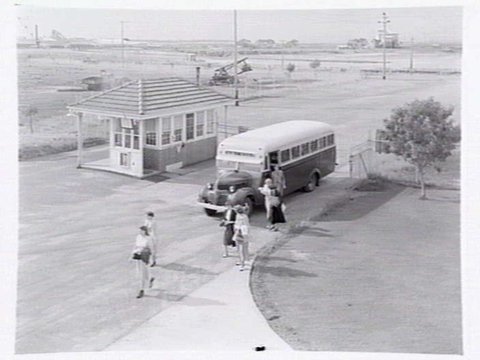 Monsanto Chemicals, Sommerville Rd., Braybrook, showing workers arriving by bus at front gate, plant and head office, 1950