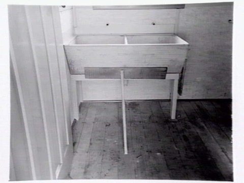 Housing Commission of Victoria pre-fabricated timber houses, showing construction in kitchen, bathroom and laundry, transfer of sections to building sites and positioning of houses on blocks at Sandringham Estate, 1949