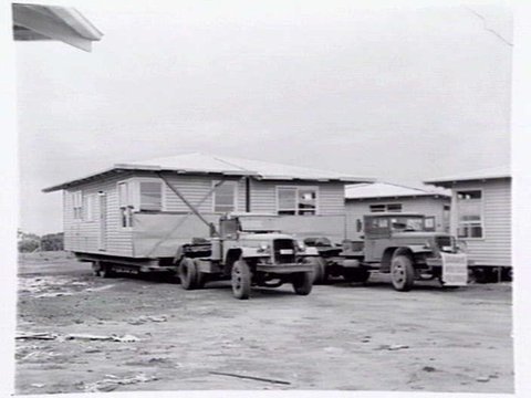 Housing Commission of Victoria pre-fabricated timber houses, showing construction in kitchen, bathroom and laundry, transfer of sections to building sites and positioning of houses on blocks at Sandringham Estate, 1949