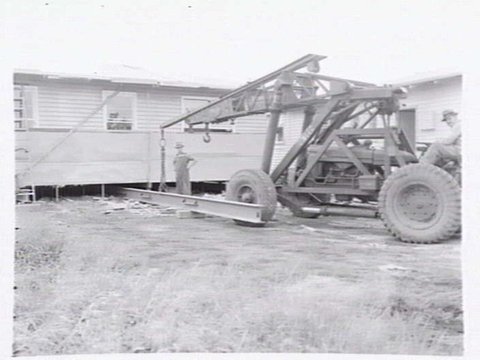 Housing Commission of Victoria pre-fabricated timber houses, showing construction in kitchen, bathroom and laundry, transfer of sections to building sites and positioning of houses on blocks at Sandringham Estate, 1949