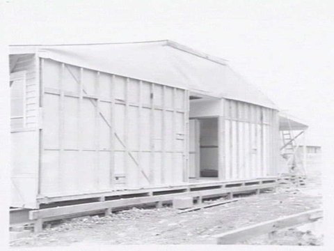 Housing Commission of Victoria pre-fabricated timber houses, showing construction in kitchen, bathroom and laundry, transfer of sections to building sites and positioning of houses on blocks at Sandringham Estate, 1949