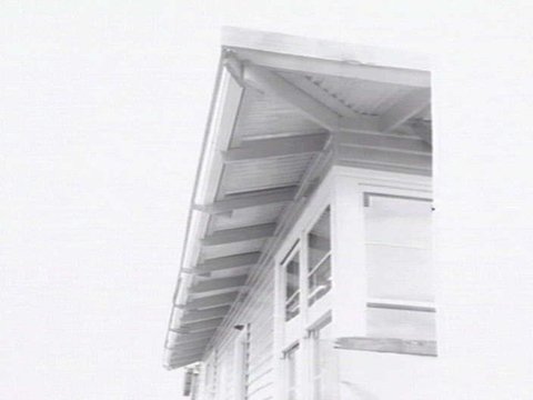 Housing Commission of Victoria pre-fabricated timber houses, showing construction in kitchen, bathroom and laundry, transfer of sections to building sites and positioning of houses on blocks at Sandringham Estate, 1949