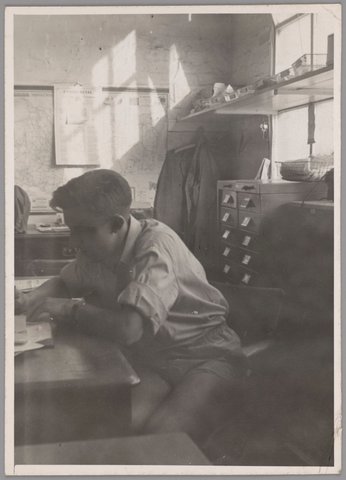 Young man at work, possibly in office of Thorne & Dean, Melbourne, 1940s
