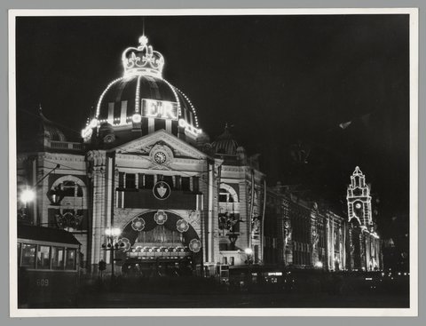 Flinders Street Railway Station (Swanston Street entrance), illuminated for Royal Visit, 1954