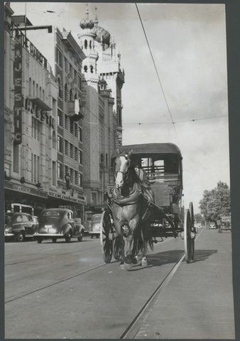 Horse and carriage on Flinders Street in tramless Melbourne, 1948