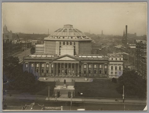 Elevated view of the State Library of Victoria, including the domed reading room, from across Swanston Street, c. 1915
