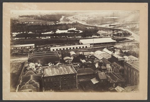 Looking South over roof-tops of Flinders Street, to the Yarra river, Princes Bridge and beyond, 1875