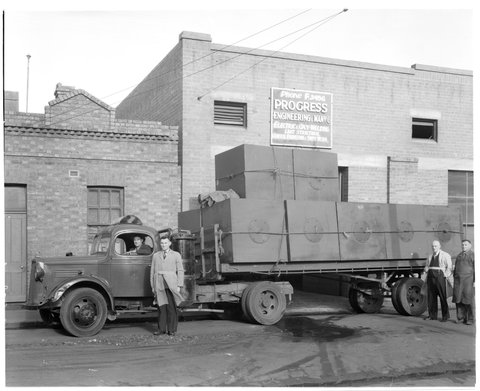 Truck loaded with tanks outside Progress Engineering & Manufacturing Co., Vale Street, North Melbourne, Vic, c. 1943