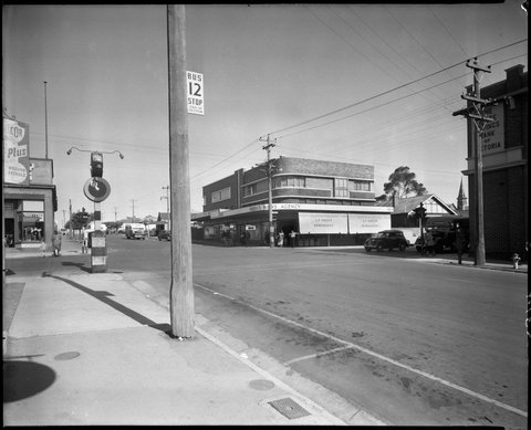 Bell St., Preston, showing intersection with High St. Greens' newsagent on corner, c. 1949
