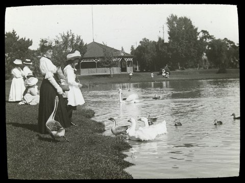 Woman and girl feeding geese, Queen's Park, Moonee Ponds, 1906–14
