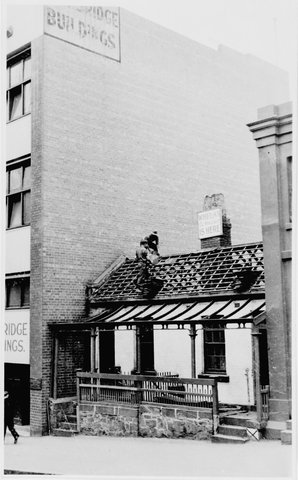 Demolition of cottages at 23-25 Exhibition St., (formerly Collins Place), Melbourne, 1941