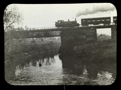 Steam train on railway bridge over the Yarra River, Victoria, 1909