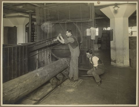 Men sawing logs into small lengths at Bryant & May factory in Richmond, 1910–30