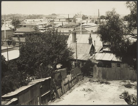 View from roof of factory looking south across Richmond, showing the cottages later demolished for the recreation area on the south west corner of the site, 1920–26