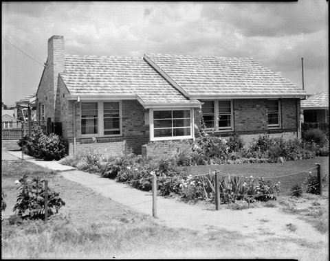 Housing Commission home with a front fence made of poles and ropes, Coburg, Preston and Heidelberg area, c. 1947