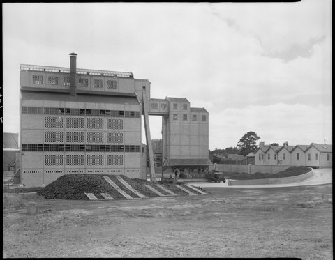 Exterior view of factory buildings and houses, Colonial Gas Association, Box Hill, c. 1945