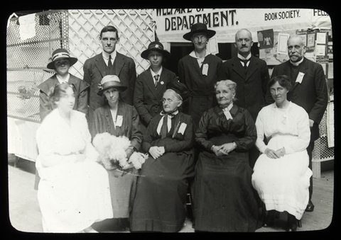Missions Bazaar, Melbourne Town Hall, group portrait of three men and eight women in front of stall and sign for the Welfare of Youth Department, 1915–24