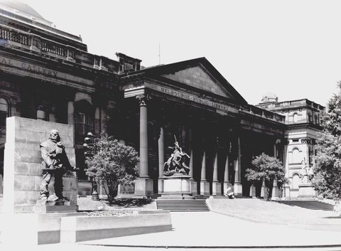Forecourt of the Public Library of Victoria (later State Library of Victoria) from the corner of Latrobe and Swanston streets, 1951