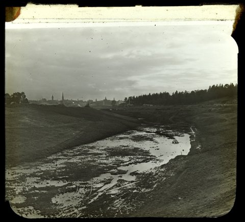 Melbourne [View towards city from along a partly excavated water channel], 1934–35