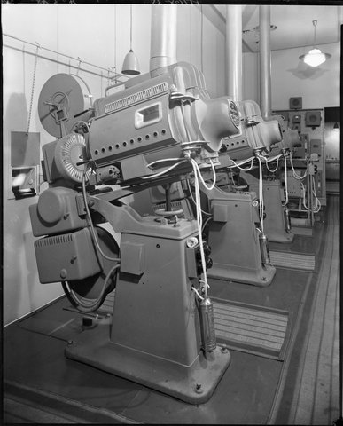 Three film projectors in projection room, Regent Theatre, Collins St, Melbourne, 1948