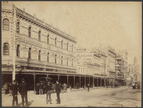 View of Elizabeth Street, looking towards Collins Street showing the Beehive Clothing Company and the Beehive Chambers, corner of Bourke and Elizabeth Streets, 1888?