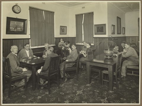 Male employees of Bryant & May, Richmond, in the Men's Club Room, 1920–30