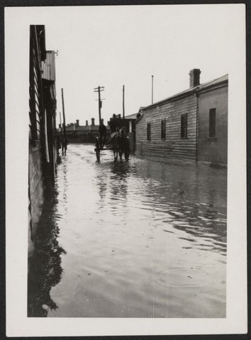 Flooded Barkly Street and some family photographs Footscray Victoria, 1924