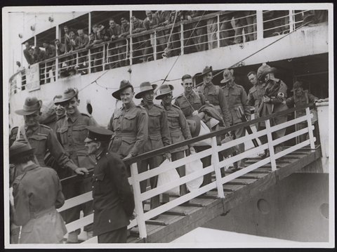 Members of the A.I.F. invalided from the Middle East, disembarking from a hospital ship, Melbourne, 1942