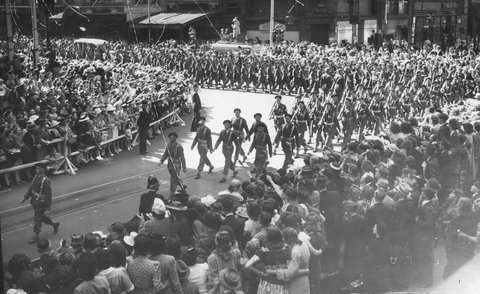 Military procession in Melbourne, near the corner of Elizabeth and Collins Streets, 1943