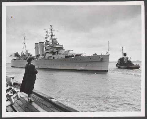 Woman watching H.M.A.S. Australia leaving Port Melbourne, 1948–53