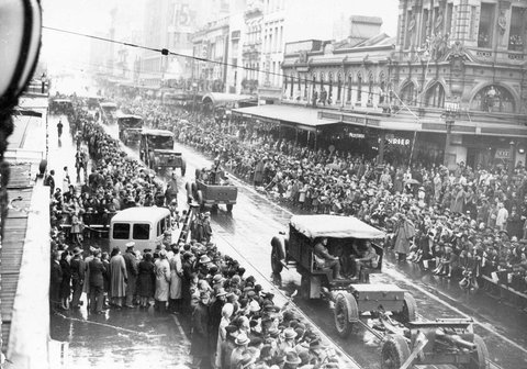Looking up Swanston Street from Collins Street at cavalry (?) or artillery units during Empire Day drive for recruits, 1938–44
