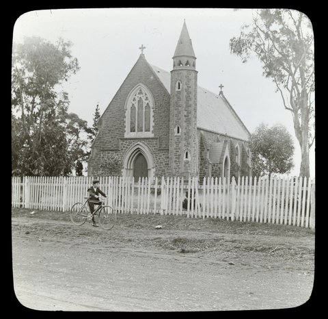Boy with a bicycle outside St. Augustine's church, Keilor, 1906–14