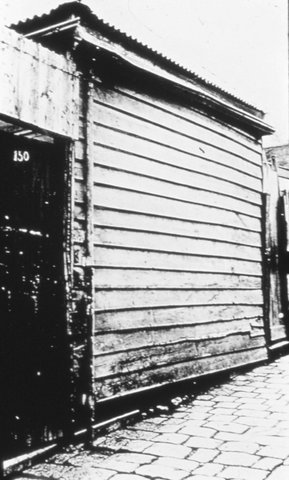 Melbourne. Side of weatherboard house, c. 1930