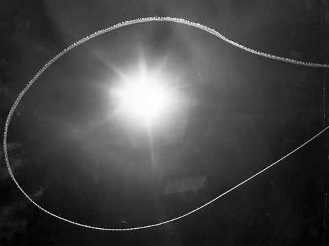 Unusual cloud pattern formed around the sun by a high flying aircraft over the city [Melbourne, Vic.], c. 1952