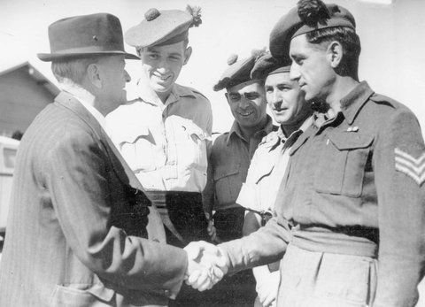 Mr. James Dewar, who joined the Black Watch in 1897, meets some of its current members in Melbourne