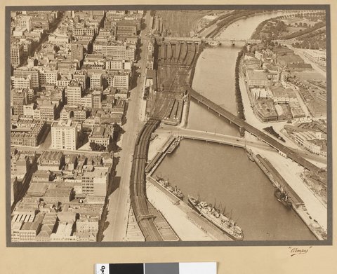 View of the Yarra River showing Flinders Street Railyway Yards and railway bridge, 1927–28