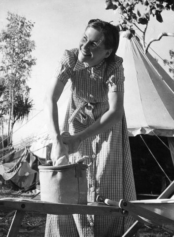 NORTHERN AUSTRALIA: Darwin. ... Jean Oliver, of Melbourne, Victoria, does some washing outside her tent, c. 1943