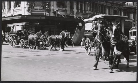 Chinese lion and drays in city of Melbourne to promote the Chinese Lion Carnival, c. 1943