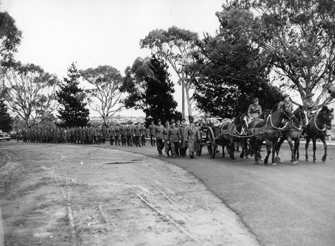 Gun carriage and officers enter Springvale Cemetery, Melbourne, for the military funeral of Lt. Stewart Woods, 1940–46